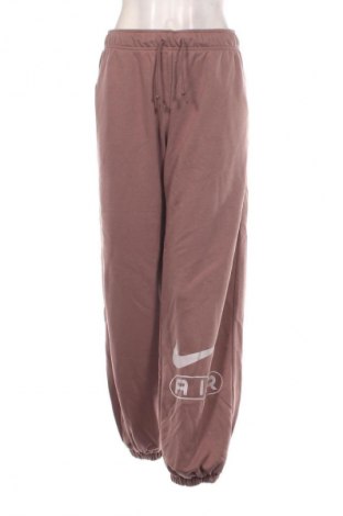 Γυναικείο αθλητικό παντελόνι Nike, Μέγεθος L, Χρώμα Σάπιο μήλο, Τιμή 59,99 €