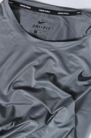 Γυναίκειο αθλητικό τοπ Nike, Μέγεθος M, Χρώμα Γκρί, Τιμή 21,03 €