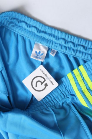 Damskie spodnie sportowe Adidas Originals, Rozmiar L, Kolor Niebieski, Cena 131,14 zł