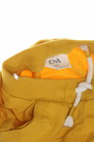 Dětské krátké kalhoty  C&A, Velikost 9-12m/ 74-80 cm, Barva Žlutá, Cena  177,00 Kč