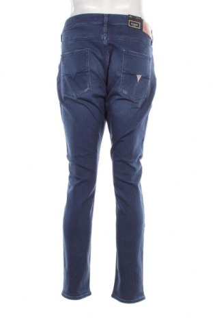 Męskie jeansy Guess, Rozmiar XL, Kolor Niebieski, Cena 498,44 zł