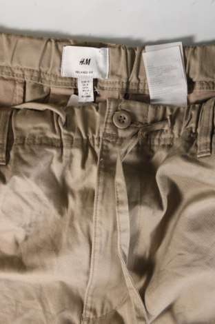 Męskie spodnie H&M, Rozmiar L, Kolor Beżowy, Cena 92,76 zł