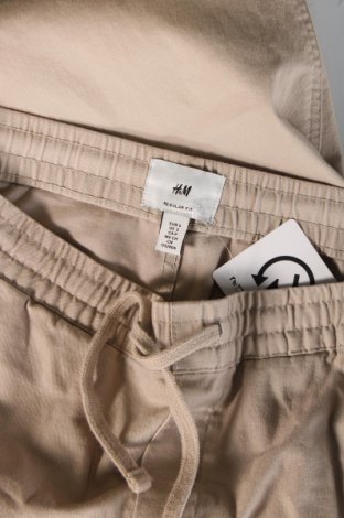 Męskie spodnie H&M, Rozmiar M, Kolor Beżowy, Cena 55,31 zł