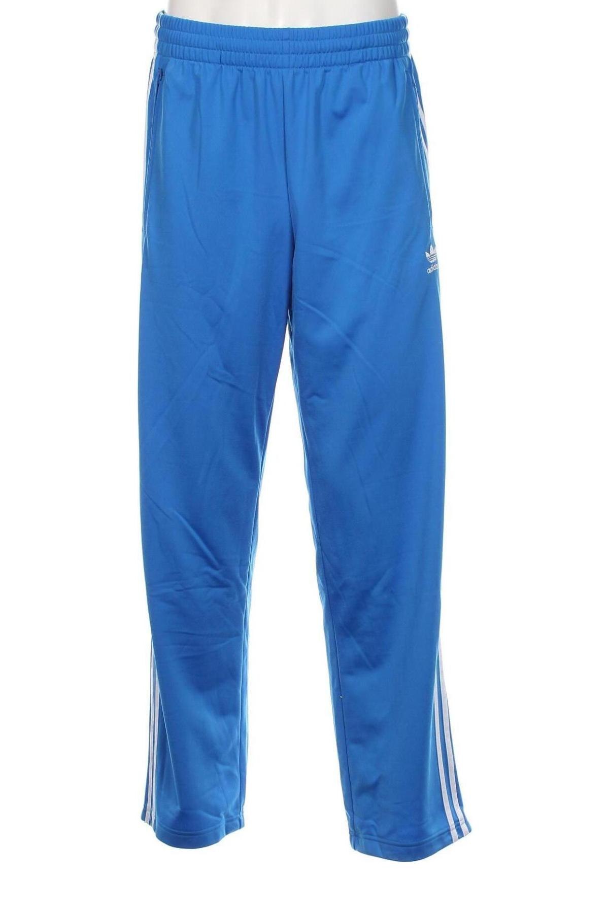 Męskie spodnie sportowe Adidas Originals, Rozmiar M, Kolor Niebieski, Cena 247,89 zł