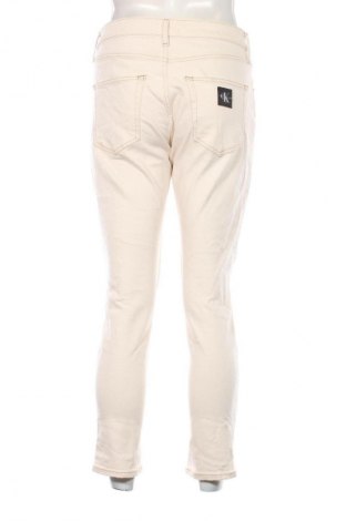 Męskie jeansy Calvin Klein Jeans, Rozmiar M, Kolor ecru, Cena 228,99 zł