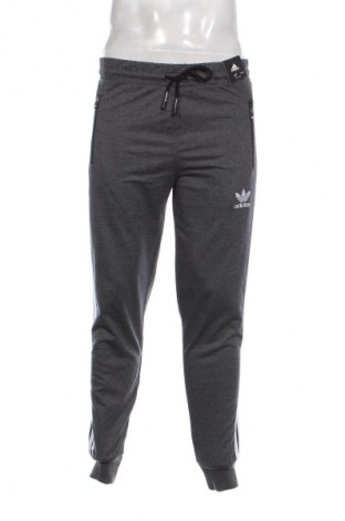 Męskie spodnie sportowe Adidas, Rozmiar M, Kolor Szary, Cena 303,99 zł