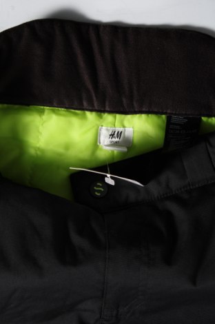 Dětské kalhoty pro zimní sporty  H&M Sport, Velikost 14-15y/ 168-170 cm, Barva Černá, Cena  527,00 Kč