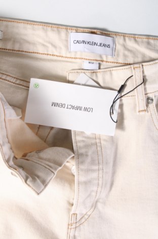 Męskie jeansy Calvin Klein Jeans, Rozmiar M, Kolor ecru, Cena 216,44 zł