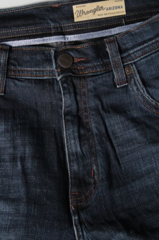 Męskie jeansy Wrangler, Rozmiar M, Kolor Niebieski, Cena 239,89 zł