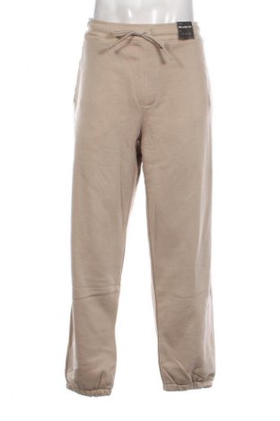Męskie spodnie sportowe Pull&Bear, Rozmiar XL, Kolor Beżowy, Cena 87,99 zł