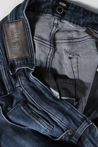 Męskie jeansy Hugo Boss, Rozmiar L, Kolor Niebieski, Cena 296,34 zł