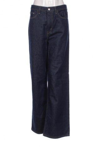 Damskie jeansy H&M, Rozmiar L, Kolor Niebieski, Cena 68,33 zł