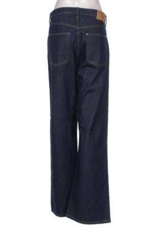 Damskie jeansy H&M, Rozmiar L, Kolor Niebieski, Cena 68,33 zł