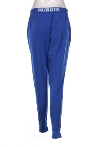 Damskie spodnie sportowe Calvin Klein, Rozmiar S, Kolor Niebieski, Cena 117,99 zł