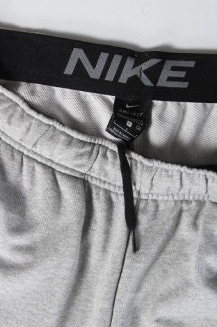 Herren Sporthose Nike, Größe L, Farbe Grau, 61% Baumwolle, 39% Polyester, Preis 40,31 €
