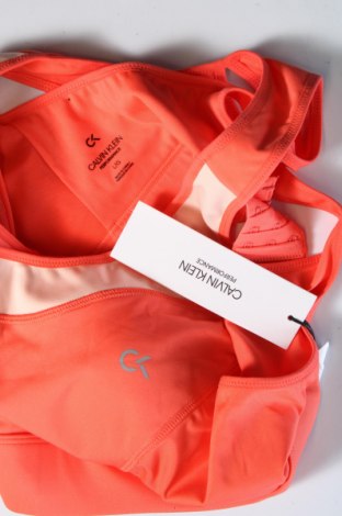 Дамски спортен топ Calvin Klein Jeans, Размер L, Цвят Оранжев, Цена 53,90 лв.