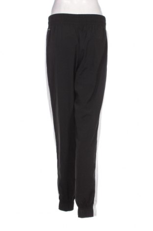 Γυναικείο αθλητικό παντελόνι PUMA, Μέγεθος M, Χρώμα Μαύρο, Τιμή 26,37 €