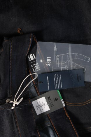 Męskie jeansy G-Star Raw, Rozmiar M, Kolor Niebieski, Cena 543,75 zł