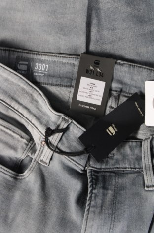 Męskie jeansy G-Star Raw, Rozmiar M, Kolor Szary, Cena 271,88 zł