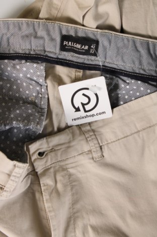 Męskie spodnie Pull&Bear, Rozmiar L, Kolor Beżowy, Cena 64,37 zł