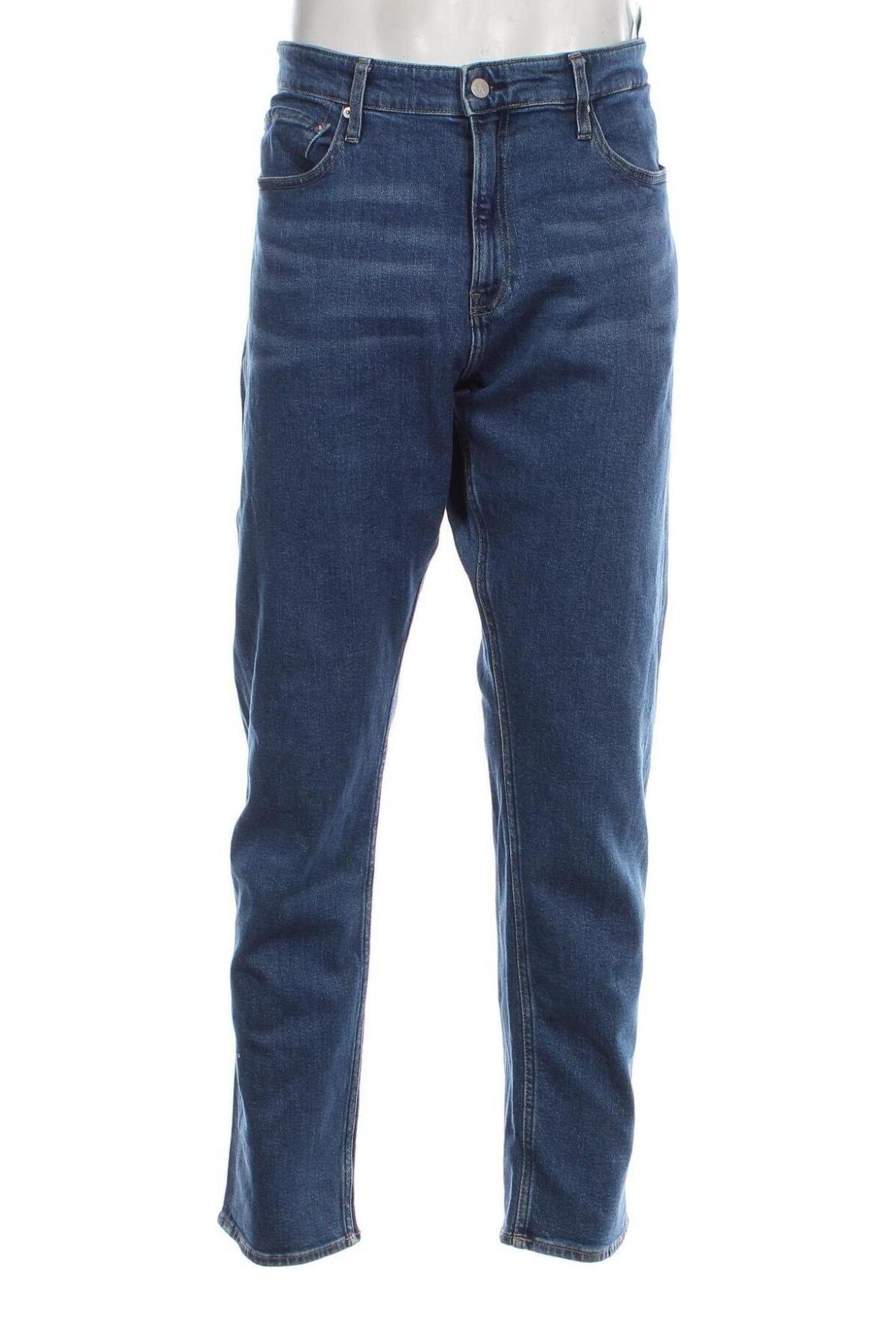 Męskie jeansy Calvin Klein, Rozmiar XL, Kolor Niebieski, Cena 262,28 zł