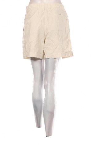 Sukně Uniqlo, Velikost M, Barva Krémová, Cena  659,00 Kč