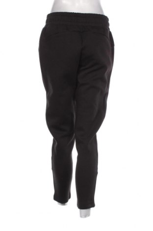 Γυναικείο αθλητικό παντελόνι PUMA, Μέγεθος M, Χρώμα Μαύρο, Τιμή 45,54 €