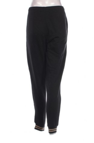 Γυναικείο αθλητικό παντελόνι PUMA, Μέγεθος L, Χρώμα Μαύρο, Τιμή 56,37 €