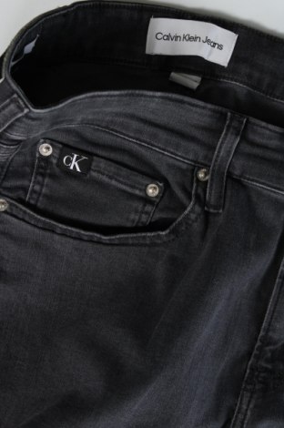 Pánske džínsy  Calvin Klein Jeans, Veľkosť M, Farba Sivá, Cena  96,39 €