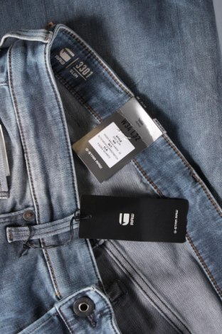 Męskie jeansy G-Star Raw, Rozmiar L, Kolor Niebieski, Cena 353,44 zł