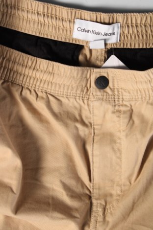 Męskie spodnie Calvin Klein Jeans, Rozmiar L, Kolor Beżowy, Cena 415,81 zł