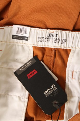 Pánske nohavice  Levi's, Veľkosť XL, Farba Oranžová, Cena  39,69 €