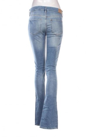 Damskie jeansy H&M, Rozmiar L, Kolor Niebieski, Cena 95,99 zł