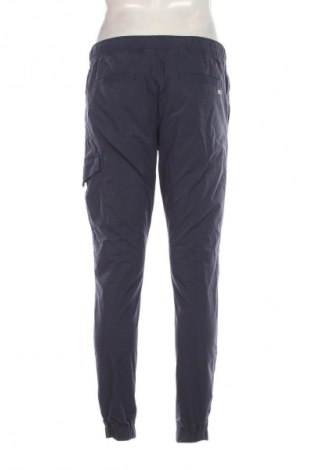 Męskie spodnie Tommy Jeans, Rozmiar S, Kolor Niebieski, Cena 118,23 zł