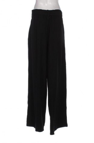 Pantaloni de femei Guido Maria Kretschmer for About You, Mărime XL, Culoare Negru, Preț 152,96 Lei