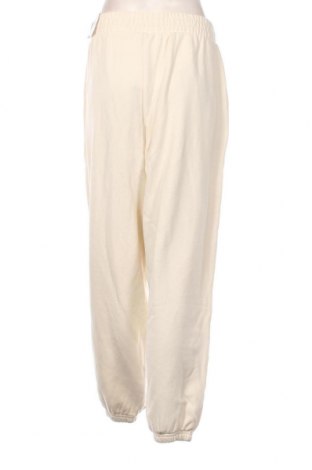 Γυναικείο αθλητικό παντελόνι PUMA, Μέγεθος L, Χρώμα Εκρού, Τιμή 28,76 €