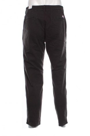 Pánske nohavice  Tommy Jeans, Veľkosť S, Farba Sivá, Cena  34,95 €