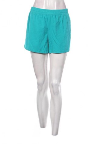 Γυναικείο κοντό παντελόνι Champion, Μέγεθος L, Χρώμα Πράσινο, Τιμή 6,18 €