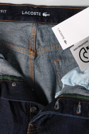 Pánske džínsy  Lacoste, Veľkosť S, Farba Modrá, Cena  57,83 €