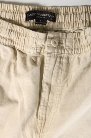 Męskie spodnie Cotton On, Rozmiar L, Kolor Beżowy, Cena 61,31 zł