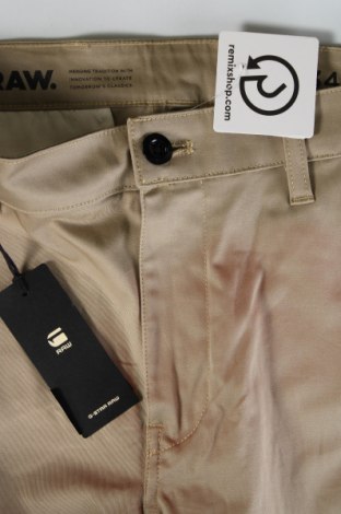 Męskie spodnie G-Star Raw, Rozmiar M, Kolor Beżowy, Cena 506,44 zł