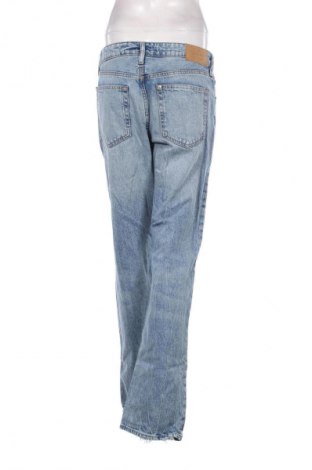 Damskie jeansy H&M, Rozmiar L, Kolor Niebieski, Cena 66,67 zł