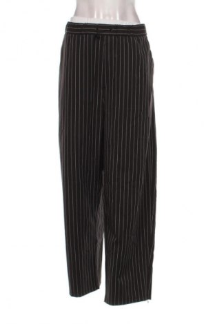 Damskie spodnie Bershka, Rozmiar L, Kolor Kolorowy, Cena 38,99 zł