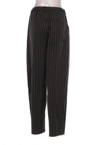 Damskie spodnie Bershka, Rozmiar L, Kolor Kolorowy, Cena 38,99 zł