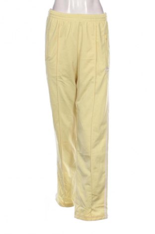 Damskie spodnie sportowe Adidas Originals, Rozmiar S, Kolor Żółty, Cena 305,99 zł