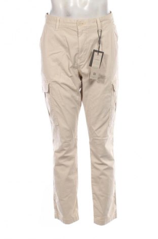 Męskie spodnie Tommy Jeans, Rozmiar M, Kolor Beżowy, Cena 604,99 zł