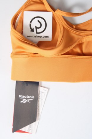 Γυναίκειο αθλητικό τοπ Reebok, Μέγεθος XXS, Χρώμα Πορτοκαλί, Τιμή 39,69 €