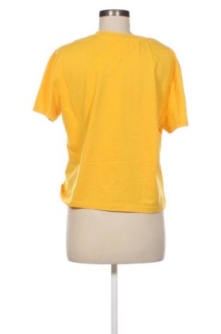 Γυναικείο t-shirt Tommy Jeans, Μέγεθος L, Χρώμα Κίτρινο, Τιμή 21,99 €
