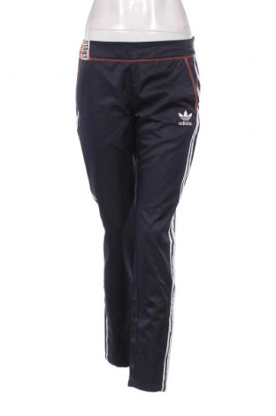 Damskie spodnie Adidas Originals, Rozmiar M, Kolor Niebieski, Cena 338,51 zł