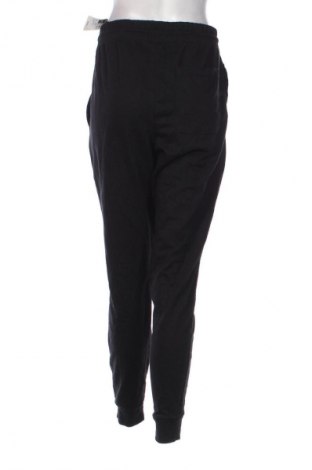 Damskie spodnie sportowe Decathlon, Rozmiar XL, Kolor Czarny, Cena 150,99 zł